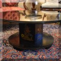 F03. Black and gold Chinoiserie table signed Katherine Henick. 36" wide. 